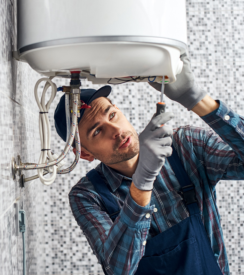 Plumber Fixing Water Heater